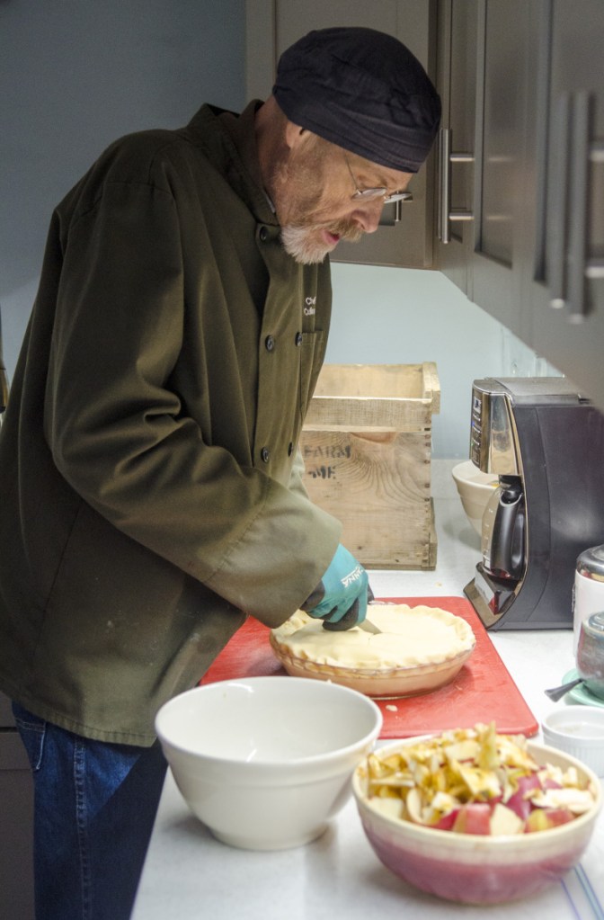 Eric Thoreson makes an apple pie Tuesday at his Winthrop home for the Rotary Club of the Winthrop Area's Thanksgiving dinner.