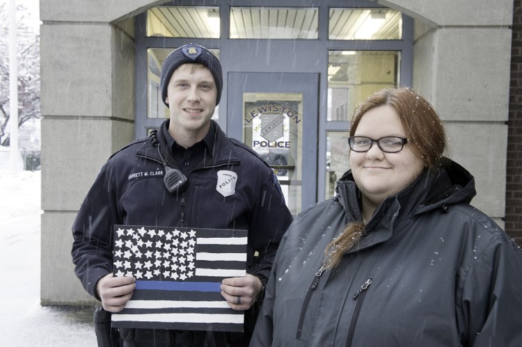 Keirsten Walder is thankful that Lewiston police Officer Garrett Clark stayed with her and encouraged her when she felt suicidal in 2017. As thanks, Walder made a Thin Blue Line American flag for Clark.