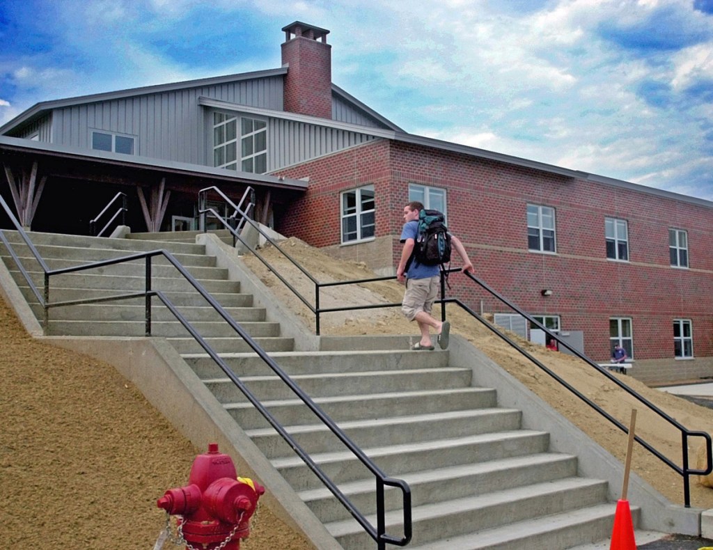 A student scales the steps to the new Maranacook Middle School in 2001 in Readfield.