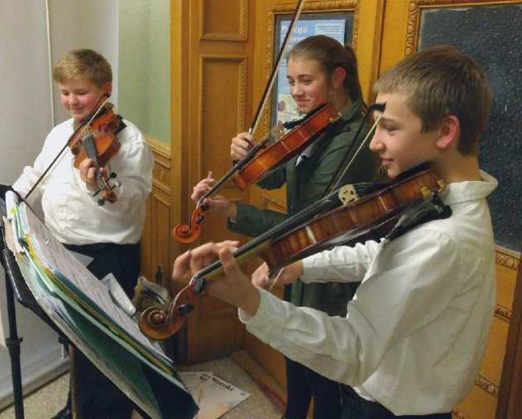 Kennebec Valley Youth Symphony Orchestra's strings students Owen Kennedy, Sophia Scheck and Aiden Montmeny recently entertained at the Bangor Savings Bank Hello Dolly reception. The students are preparing for their upcoming Dec. 9 concert at Hall-Dale High School in Farmingdale. For more information, visit <a href="http://www.kvyso.org">www.kvyso.org</a>.