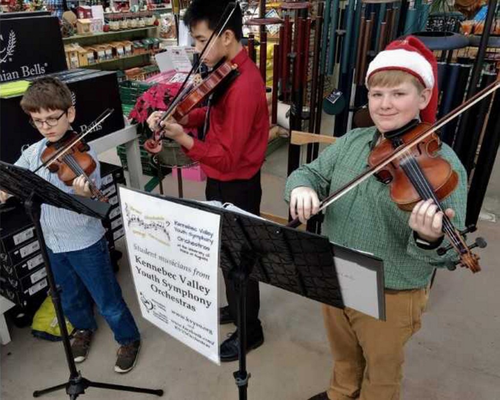 Kennebec Valley Youth Symphony Orchestra's violinists Alden Gilg, Ethan Vattaso, and Owen Kennedy recently offered festive music for Longfellow's Greenhouses' Holiday Open House in Manchester. The students are preparing for their upcoming Dec. 9 concert at Hall-Dale High School in Farmingdale. For more information, visit <a href="http://www.kvyso.org">www.kvyso.org</a>.
