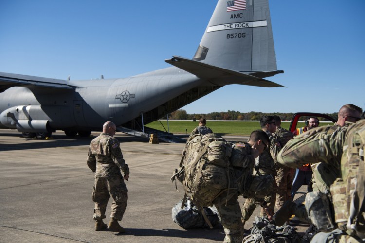 Members of Headquarters Company, 89th Military Police Brigade, Task Force Griffin get ready to board a C-130J Super Hercules from Little Rock, Arkansas, at Fort Knox, Kentucky, in support of Operation Faithful Patriot in a photo dated Monday.