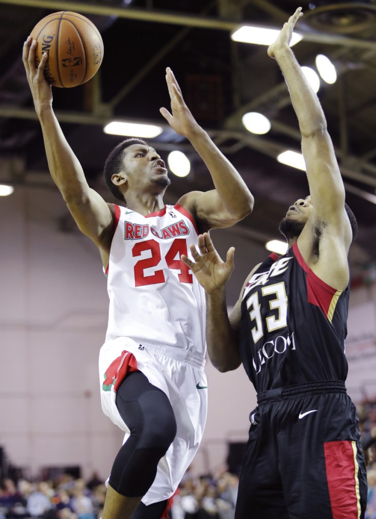 PORTLAND, ME - NOVEMBER 5: Red Claws' Andrew White, left, goes up for a shot while being guarded by Erie Bayhawks' Jeremy Hollowell, right, during the second period of their game Sunday, Nov. 5, 2017 in Portland, Maine. (Staff Photo by Joel Page/Staff Photographer)