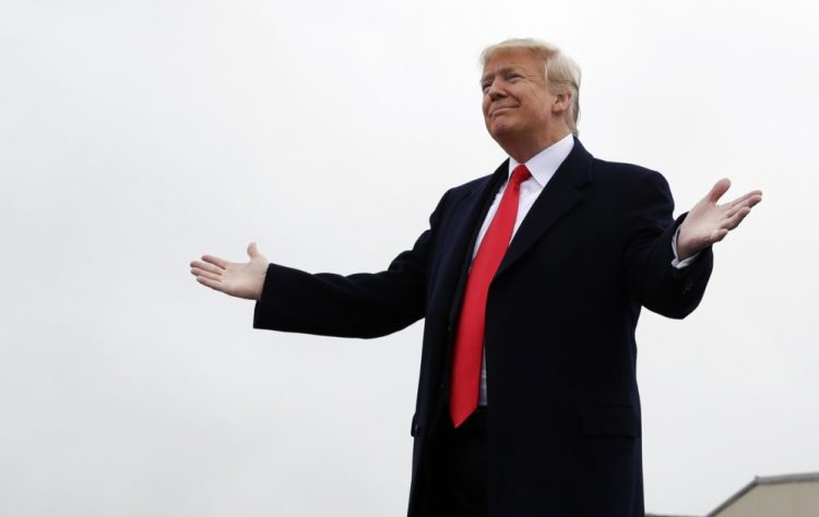 President Trump attends a rally at Bozeman Yellowstone International Airport on Saturday in Belgrade, Mont., to support Senate candidate Matt Rosendale.