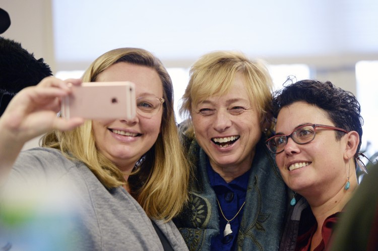 Gov.-elect Janet Mills poses Wednesday with Leah Bruns of South Portland, left, and Doris Santoro of Portland at Becky's Diner in Portland on the morning after her historic win. Mills acknowledged the significance of being Maine's first female governor, but as she did during her campaign, also downplayed it. "I'd like to think I am the most qualified person for the job," she said.