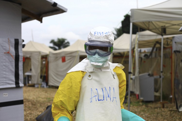A health worker in protective gear arrives in September at an Ebola treatment centre in Beni, Eastern Congo.