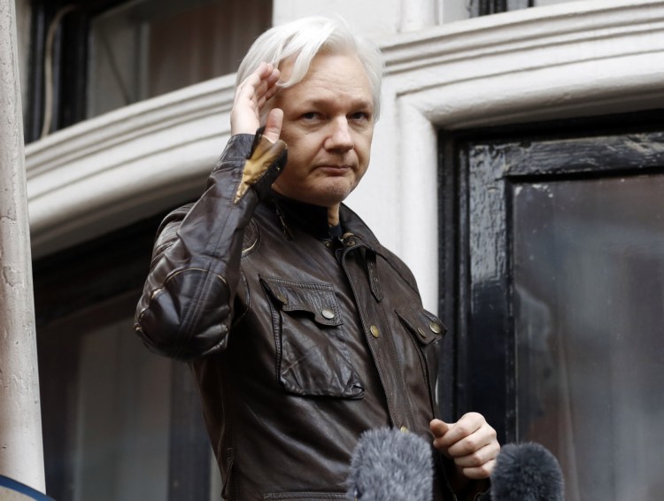 WikiLeaks founder Julian Assange greets supporters from a balcony of the Ecuadorian embassy in London. in 2017.