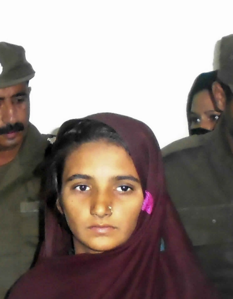 Aasia Bibi is presented to journalists at a police station in Muzaffargarh, Pakistan, in 2017.