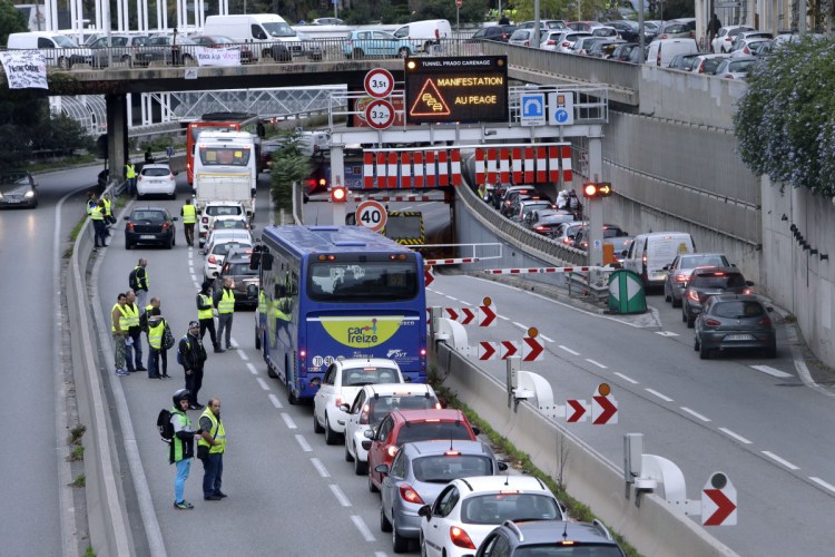 Demonstrators block a motorway exit to protest fuel taxes in Marseille, southern France, on Saturday. French interior ministry officials say that one protester was killed and more than 40 injured as demonstrators blocked roads around France to protest gas price increases.