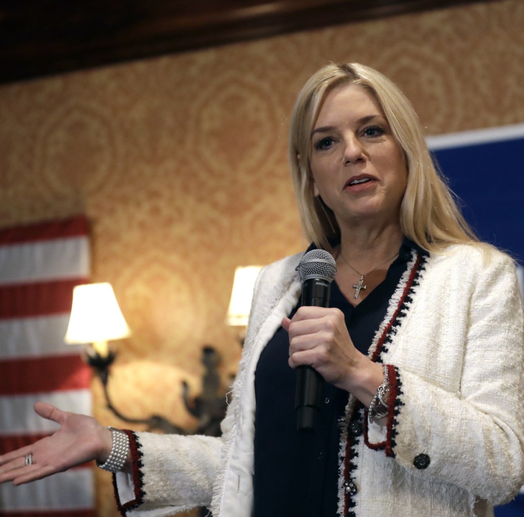 Florida Attorney General Pam Bondi says the nation's two largest drugstore chains "played a role in creating the opioid crisis" plaguing the U.S.
