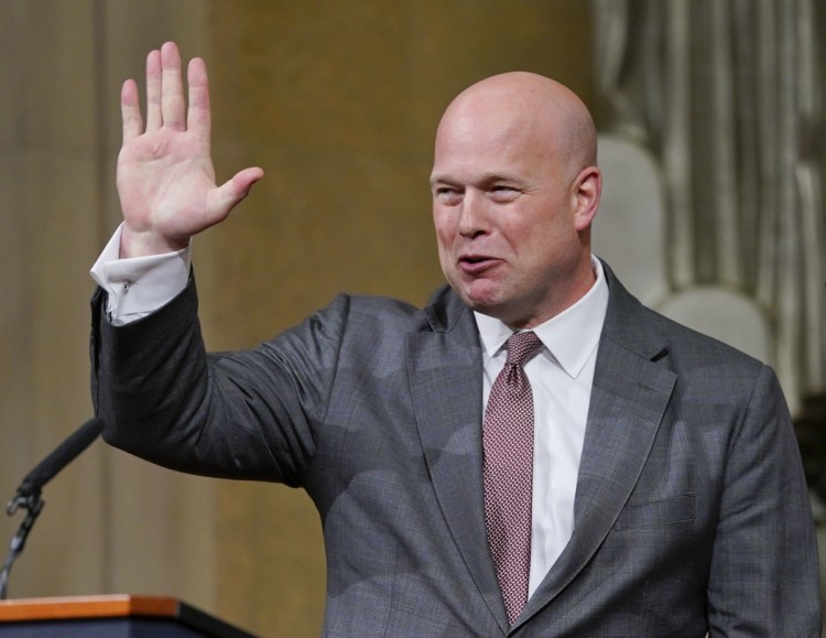 Acting Attorney General Matthew Whitaker gestures after speaking at the Deptartment of Justice on Thursday in Washington.