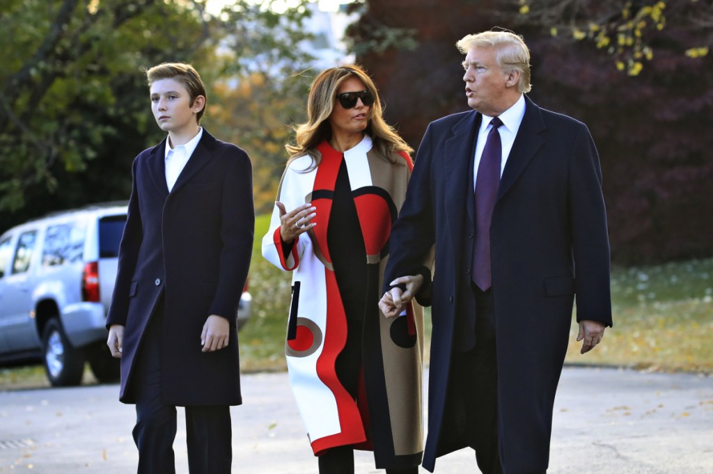 President Trump, first lady Melania Trump and their son Barron Trump walk across the South Lawn of the White House on Tuesday to board the Marine One. The family is traveling to Florida, where they will spend Thanksgiving at Mar-a-Lago.