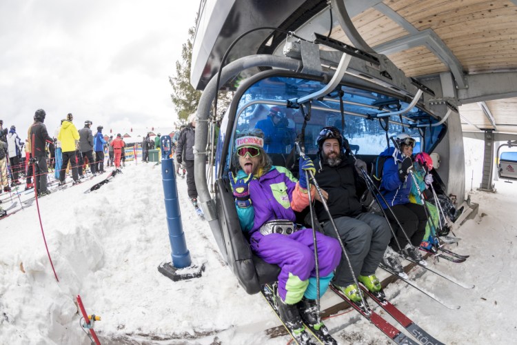 Skiers prepare to ride a chair lift at the Mount Snow ski resort in West Dover, Vt., this month. Early-season snow and cold temperatures are helping New England ski resorts start off the season strong.