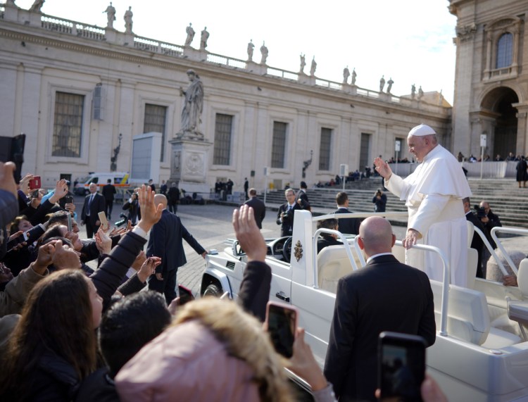 Pope Francis leaves at the end of his weekly general audience, in St. Peter's Square on Wednesday.