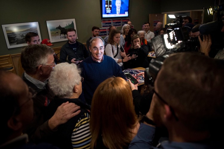 Rep. Bruce Poliquin greets supporters and speaks with the press at Dysart's Travel Stop in Bangor on Tuesday, at what they hoped would be a re-election party. 