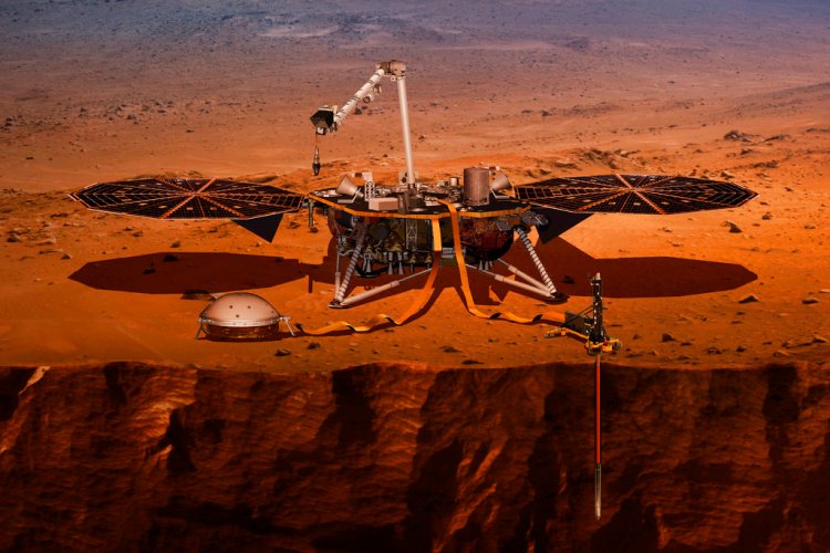 This illustration made available by NASA in 2018 shows the InSight lander drilling into the surface of Mars. InSight, short for Interior Exploration using Seismic Investigations, Geodesy and Heat Transport, is scheduled to arrive at the planet on Monday, Nov. 26, 2018. 
