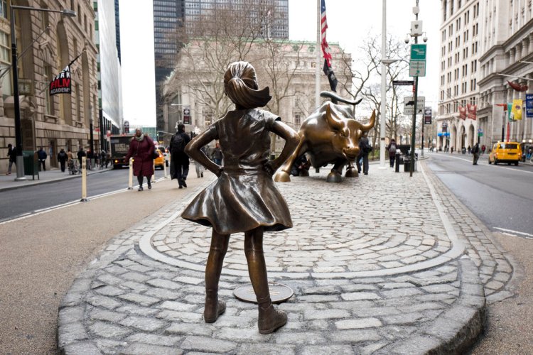 The Fearless Girl statue faces Wall Street's Charging Bull statue in New York in March 2017. The statue that has become a global symbol of female can-do business spirit, has been removed from her spot facing the "Charging Bull" to await a new home by the New York Stock Exchange. 