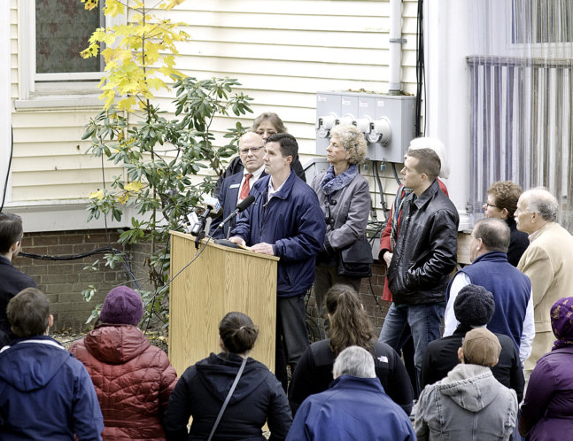 Greg Payne, director of the Maine Affordable Housing Coalition, talks about the $4 million state lead abatement program that will benefit 200 homes in Maine. Payne spoke Thursday outside an apartment building in Lewiston.