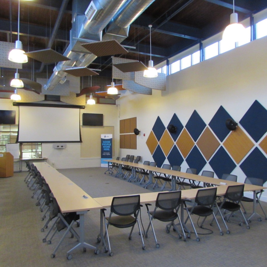 High ceilings and exposed beams in the unit's huge conference room.