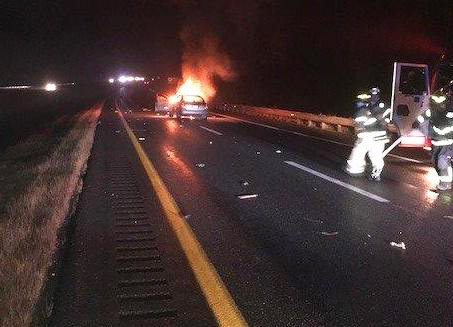 Police say Anthony Hodge was distracted by his cellphone when his car slammed into the rear of a 2003 Dodge Dakota on Interstate 95 in Hampden on Thursday night. Hodge's car caught fire.