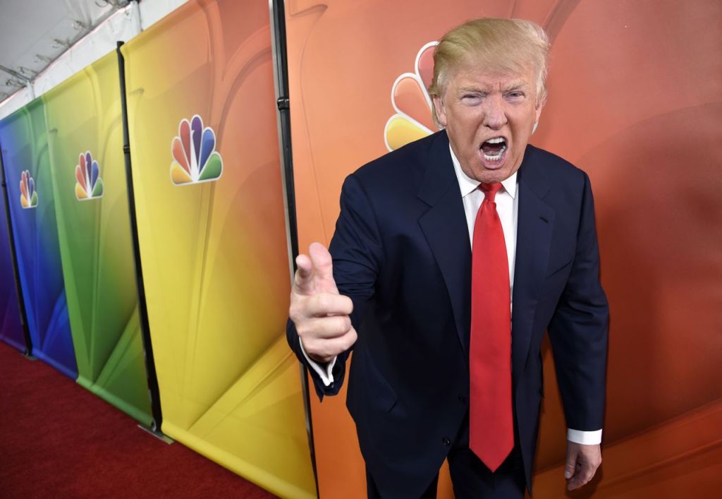 Donald Trump, then-host of "The Celebrity Apprentice," mugs for photographers at an NBC media event in Pasadena, Calif., on  June 29, 2015. 