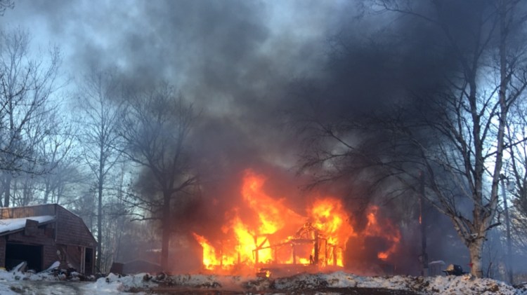 A fire Thursday morning destroyed a mobile home on Canton Point Road in Dixfield. The family, including an infant and a dog, escaped unharmed.