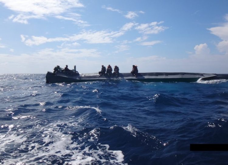 Crew members from the Coast Guard Cutter Campbell stop a suspected drug smuggling boat in the eastern Pacific Ocean during a patrol in October. During the 90-day patrol, the Campbell seized about 5,300 kilograms of cocaine, with an estimated value of $159 million, the Coast Guard says.