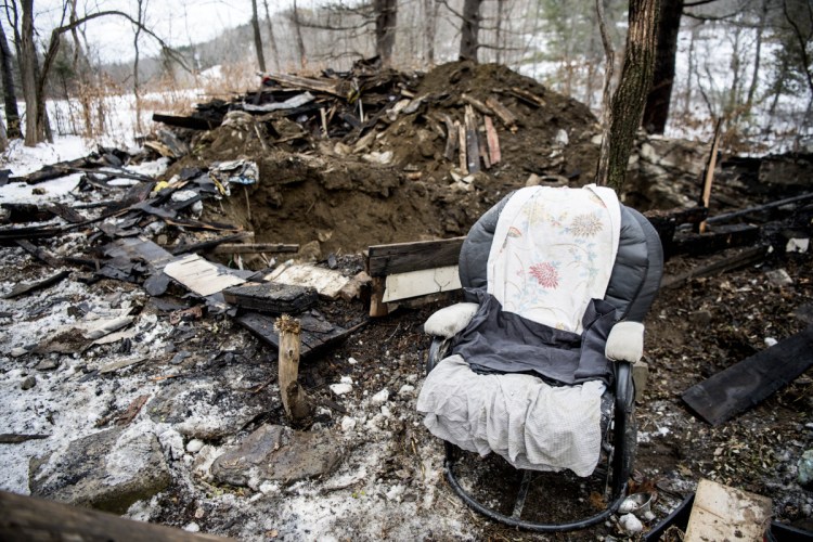 A chair and some appliances are all that remain at an abandoned house was destroyed by fire early Saturday morning on North Avenue in Skowhegan. Authorities had to excavate the remnants of the house. It is the property where law enforcement earlier this year searched for Tina Stadig, who remains missing.