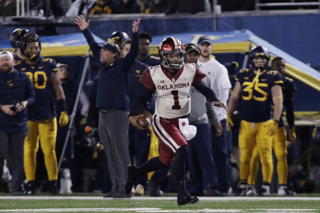 Oklahoma quarterback Kyler Murray (1) runs the ball for a touchdown during the first half against West Virginia on Nov. 23 in Morgantown, West Virginia.