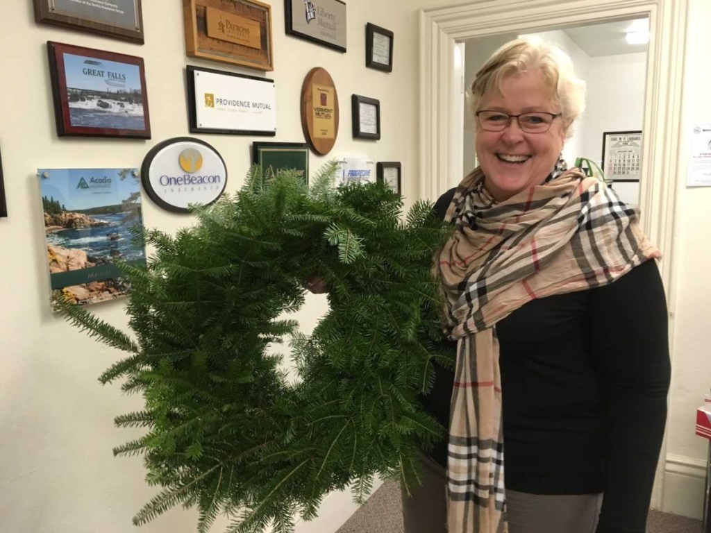 Sheila Sawyer from Carl Larrabee Insurance Agency was in the holiday spirit when she received her wreath to decorate for Wreaths Around the Holidays, a display at Wiscasset Holiday Marketfest. She's already tapped an office mate to help with the decorating. For a calendar of marketfest activities, visit <a href="http://www.wiscassetholidaymarketfest.com">www.wiscassetholidaymarketfest.com</a>.