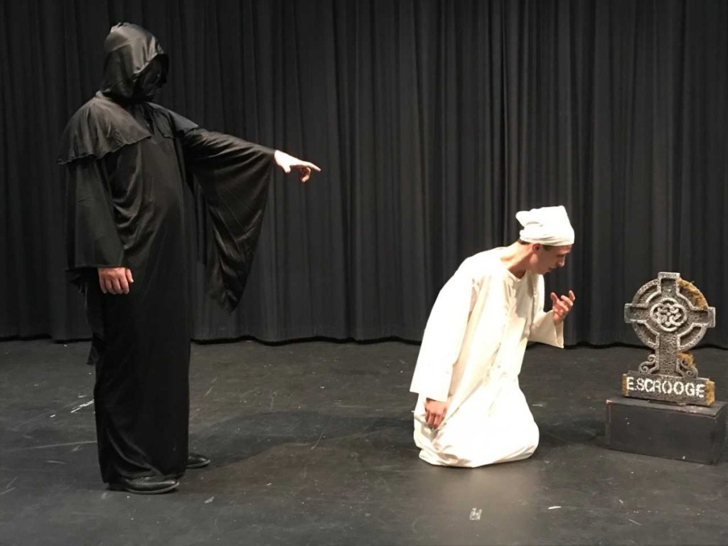 Marco Aliberti, left, principal at Oak Hill High School, as the Ghost of Christmas Future, and James Greenwood as Ebeneezer Scrooge.