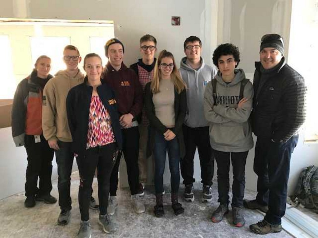 Taking part in the design and building of the interactive sand table exhibit from left are Caitlin Hanlon, Ed Tech; Tyson Hill, Katie Holmes, Noah Bell, Colin Hutchins, Bradie Reynolds, Connor Damon, Sebastian Fournier and Jake Bogar, teacher.