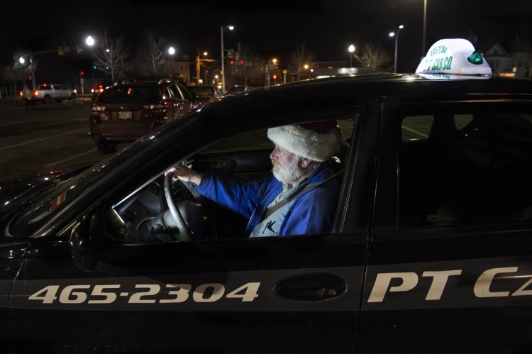 Mike Paradis, a driver for PT Cab, drives through the Concourse on Thursday. PT Cab is the only taxi company based in Fairfield. Oakland has one cab company based in its town and Waterville has three cab companies based in its city.