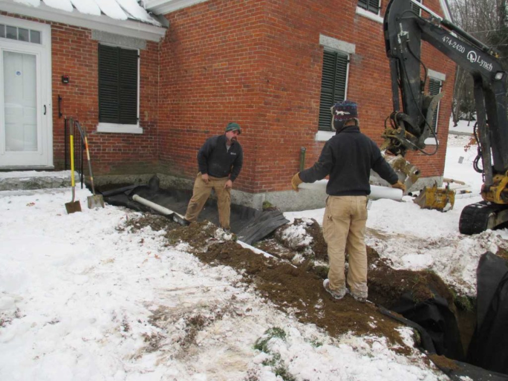 French drains were installed in November by Lynch Landscaping workers Jorden Burdet, left, and Gage Currie.