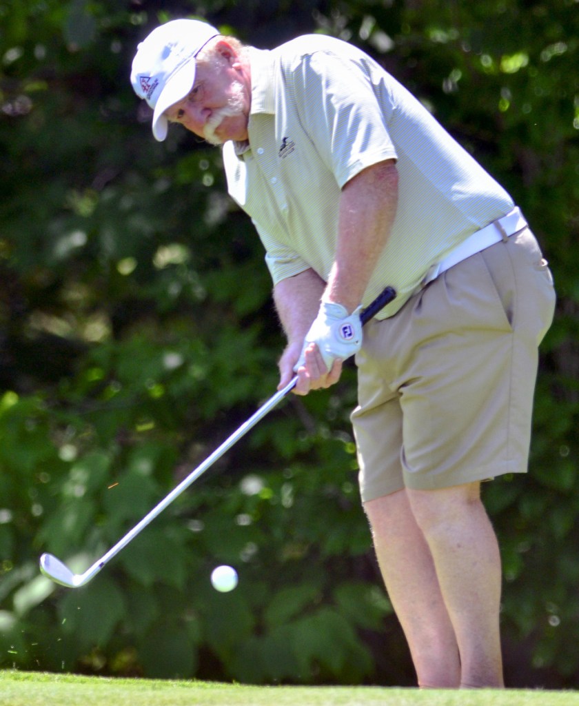 Mark Plummer chips during the Maine Amateur Championship in July at the Belgrade Golf Club. Plummer was a friend of late president George H.W. Bush. The two played golf together on several occasions, and Plummer recently attended Bush's funeral in Washington, D.C.
