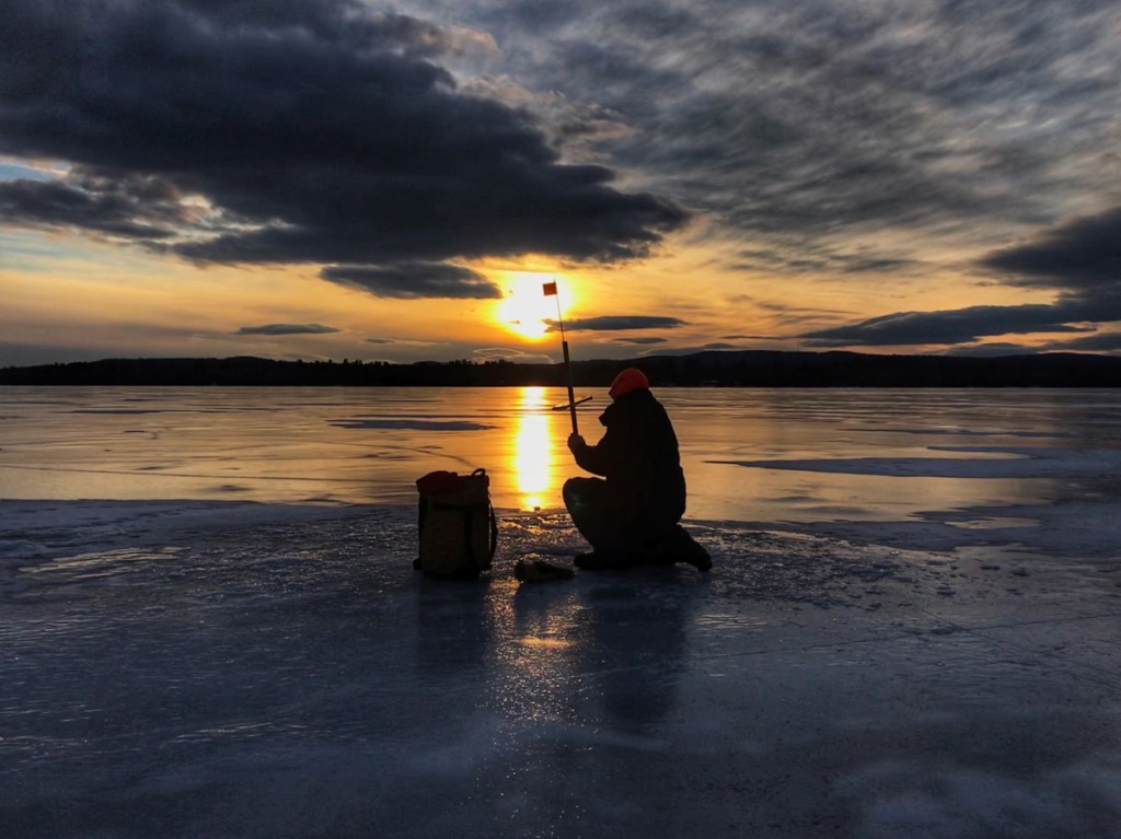 Tony LeBlanc, of Madison, ice fishing on North Pond in Smithfield.