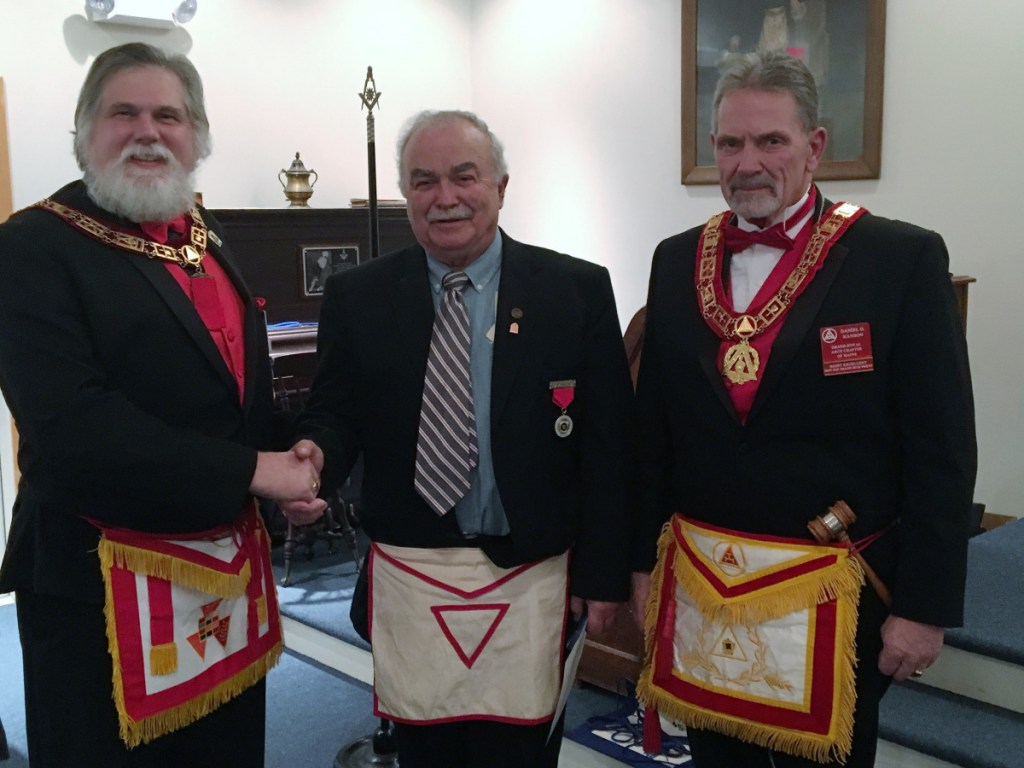 Ronald Emery, of China, center, received his 50 Year Pin at Dunlap Chapter No. 12 at the Stated Meeting held Wednesday evening. Inspection by the Grand Officers was on the Most Excellent Degree with Emery setting in the East. He was presented the 50 year pin by Most Excellent Grand High Priest Brian S. Messing, left, and Right Excellent Daniel Hanson, District Deputy Grand High Priest.
