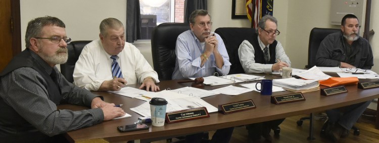 Somerset County Commissioners, from left, Cyp Johnson, Lloyd Trafton, Newell Graf Jr., Robert Sezak and Dean Cray, voted 3-2 against rescinding support for CMP's New England Clean Energy Connect project during a meeting in Skowhegan on Wednesday.
