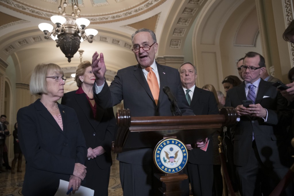 Senate Minority Leader Chuck Schumer, D-N.Y., Sen. Patty Murray, D-Wash., Sen. Debbie Stabenow, D-Mich., and Sen. Dick Durbin, D-Ill., the assistant Democratic leader, talks to reporters about the possibility of a partial government shutdown, at the Capitol in Washington on Tuesday. Senators passed measure to keep government running to Feb. 8, by voice vote without a roll call.