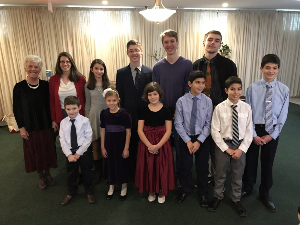 Students of Muriel Desrosiers performed during a Christmas piano and instrumental program Dec. 16 at the Goudreau's Retirement Inn in Winslow. In front, from left, are Luke Quirion,Susanna Gonnella, Maria Nawfel, Chris Nawfel, John Nawfel and Elias George Nawfel. In back, from left, are Muriel Desrosiers, Cindy Dionne, Elizabeth Dionne Gabe Cota, Richard Preston and Ian Maxwell.