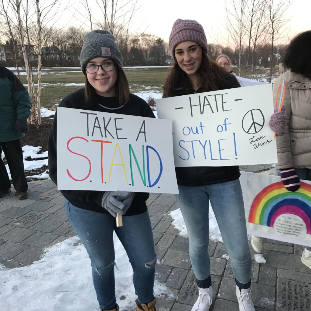 Kira Sencabaugh, left, and Jacie Richard at the Head of Falls after the Taking Action Negotiating Diversity walk for peace and unity in Waterville recently.