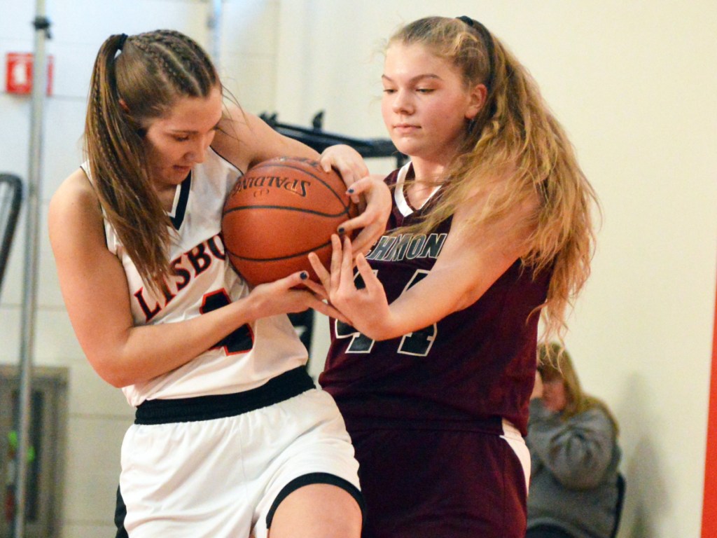 Times Record photo by Bob Conn 
 Lisbon's Charlee Cox, left, and Richmond's Macy Carver (44) battle for possession during Saturday's MVC game in Lisbon.