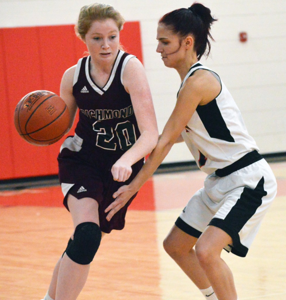 Times Record photo by Bob Conn 
 Richmond's Bryanne Lancaster (20) looks to drive past the defense of Lisbon's Sydney Plourde during Saturday's MVC game Saturday in Lisbon.