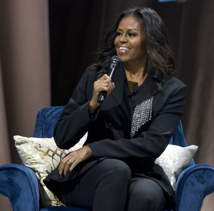 Michelle Obama talks in Washington about her new memoir, "Becoming." Obama topped Gallup's annual poll of most admired women.