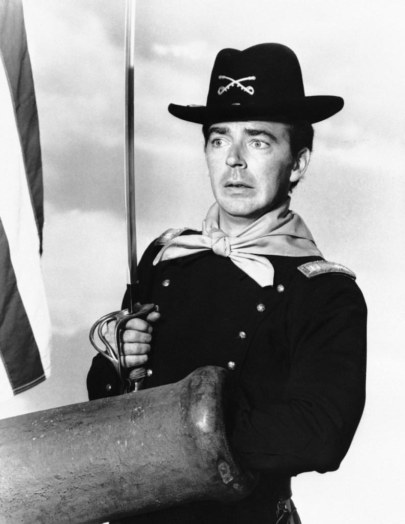 Ken Berry, playing Capt. Wilton Parmenter, reaches down the wrong end of cannon in a 1965 episode of the TV series "F Troop." A spokeswoman at Providence St. Joseph in Burbank, Calif., confirmed Berry died Saturday. He was 85. (Associated Press)