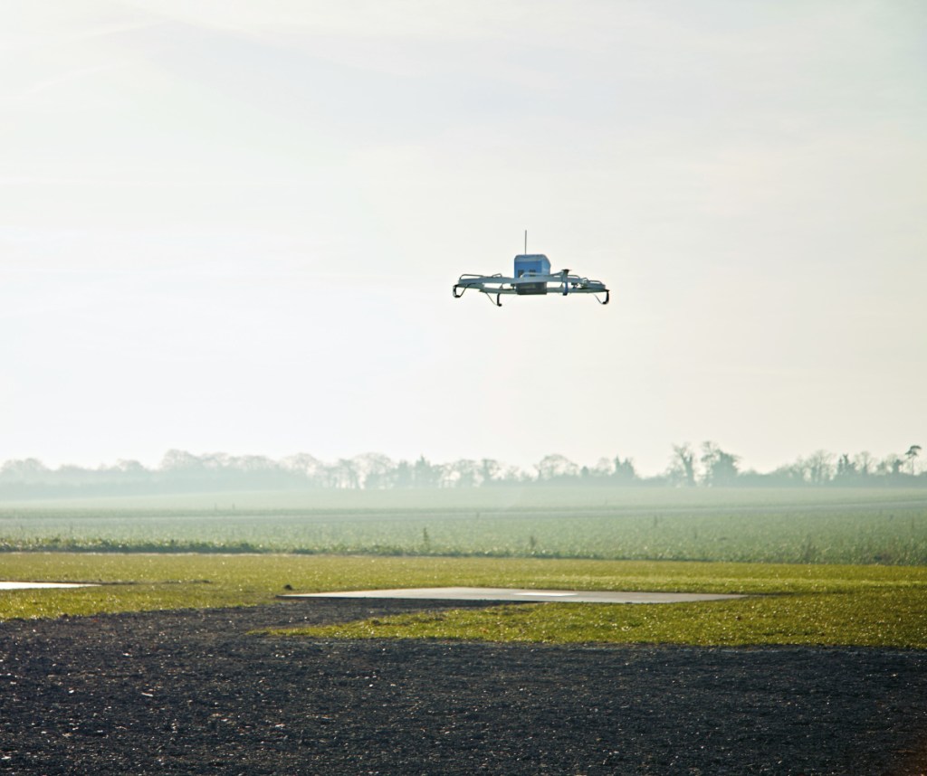 An Amazon Prime Air drone flies in Cambridgeshire, United Kingdom, in 2016. The company says it is still pushing ahead with plans to use drones for quick deliveries. It has drone development centers in the U.S., Austria, France, Israel and the United Kingdom.