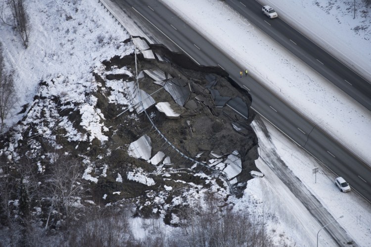 This aerial photo shows damage at the Glenn Highway near Mirror Lake after earthquakes in the Anchorage area of Alaska on Friday. Scientists at the U.S. Geological Survey say a 4.6-magnitude aftershock occurred shortly after 7 a.m. Tuesday and was felt in Anchorage.