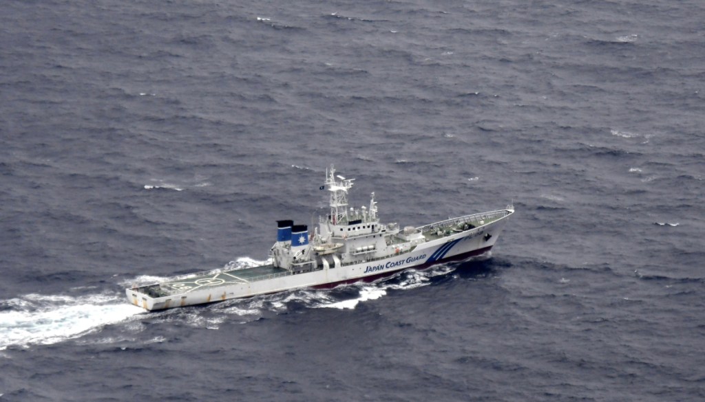 A Japanese Coast Guard ship is seen at sea during a search and rescue operation for missing crew members of a U.S. Marine refueling plane and fighter jet off Muroto, Kochi prefecture, southwestern Japan, on Thursday.