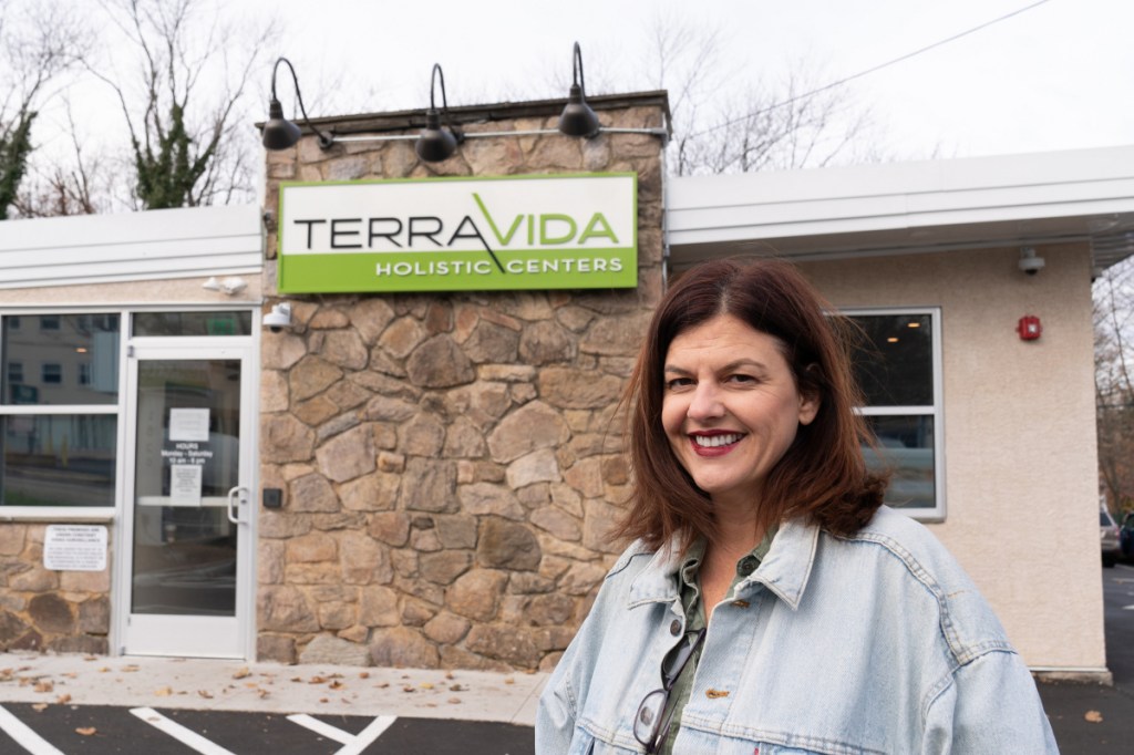 Chris Visco, president and CEO of TerraVida Holistic Center, stands at her Abington, Pa., store. Visco sells more legal cannabis than any other legal dealer in the state. She has 80 employees and hopes to open six more spa-like dispensaries next year.