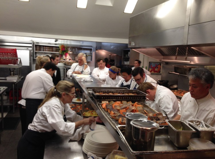 Chefs Clark Frasier and Mark Gaier prepare the 25th anniversary dinner for their former restaurant Arrows in Ogunquit in 2013 with the help of some fellow “Top Chef Masters” contestants. Frasier and Gaier say one of the best parts of doing the show was the friends they made.